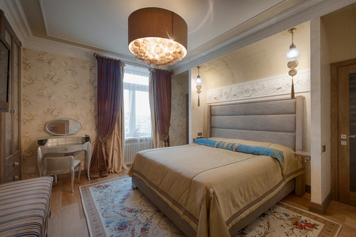 chandelier on the ceiling in the interior of the bedroom