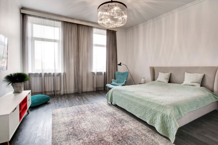 chandelier on the ceiling in the middle of the bedroom