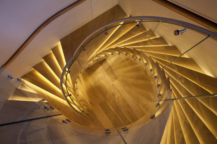 illumination of a spiral staircase in the house illumination of a spiral staircase in the house