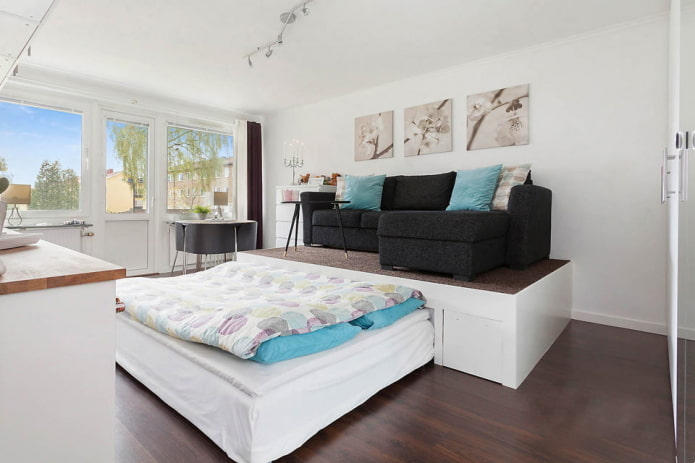 bed on the podium in the interior of the living room bed on the podium in the interior of the living room