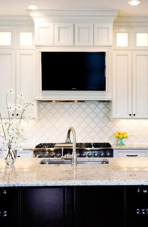 TV over the hood in the kitchen