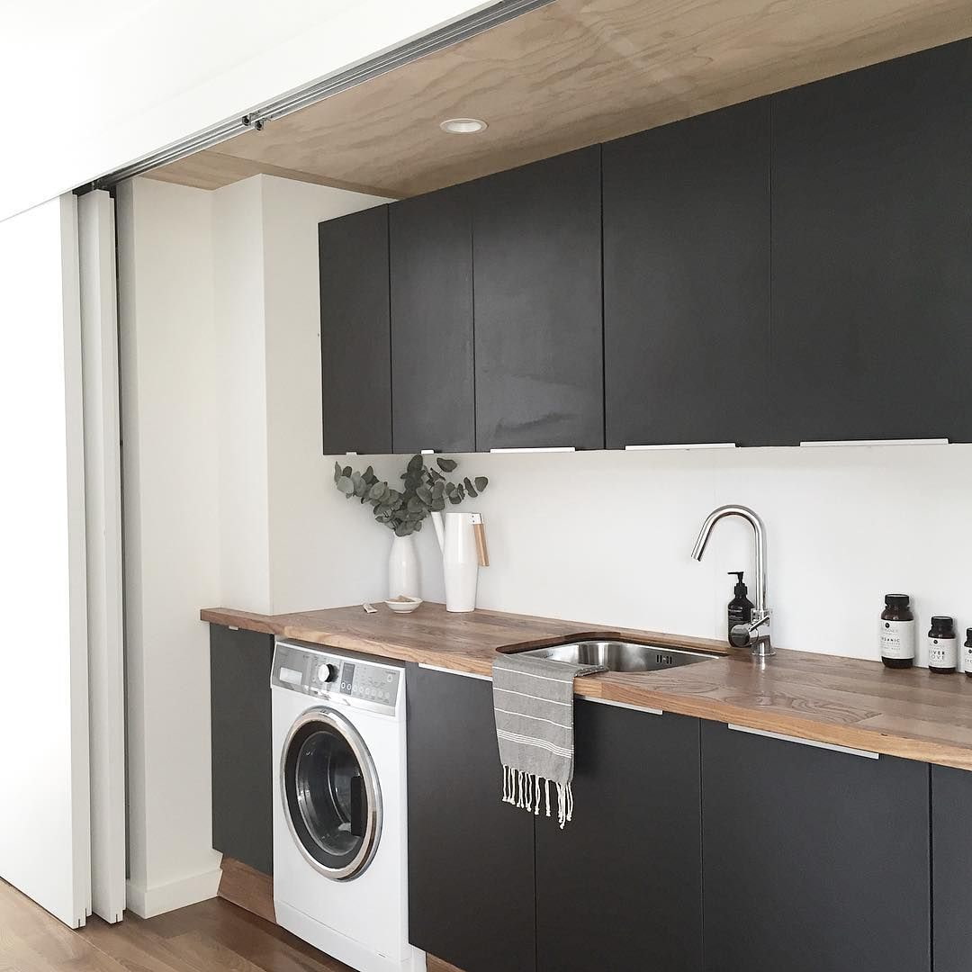 black kitchen with white washer