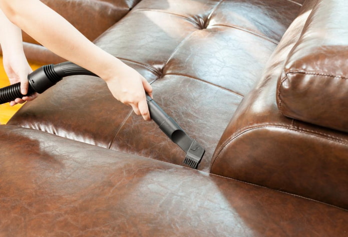 Cleaning the upholstery with a vacuum cleaner Cleaning the upholstery with a vacuum cleaner