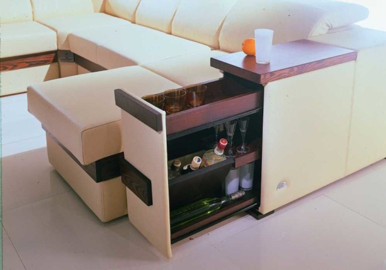 shelves in the armrest of the sofa