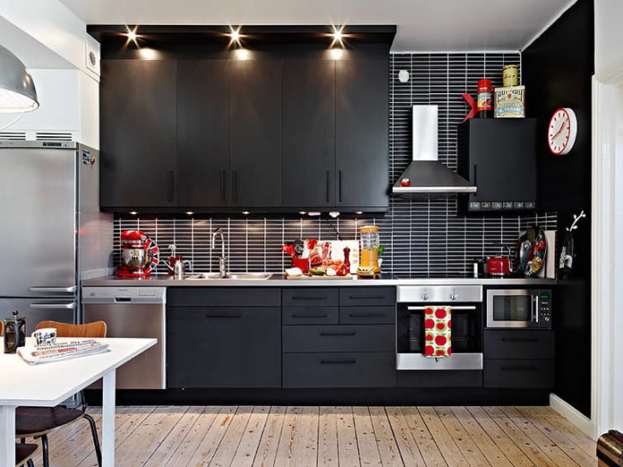 Red accents in a dark kitchen