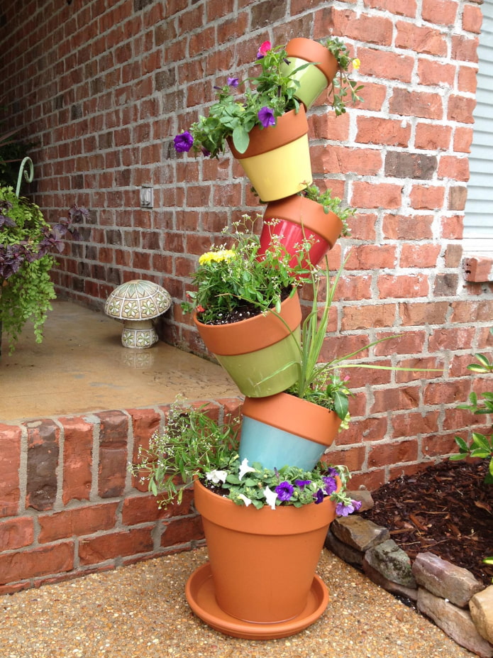 Vertical flowerbed of pots Vertical flowerbed of pots