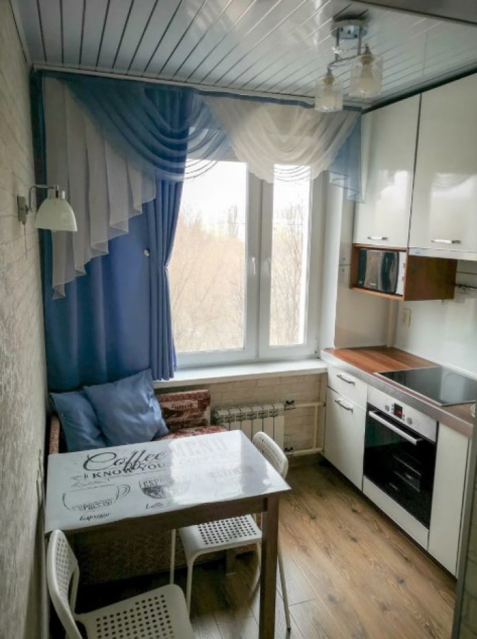 blue short curtains in the kitchen