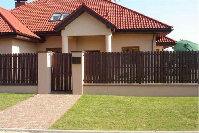 Fence from metal strips for the house Fence from metal strips for the house