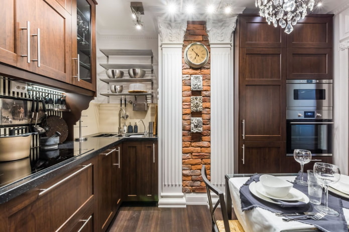 Wooden kitchen with a brick box in the center of the wall