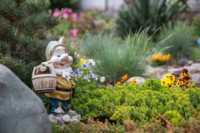 Dwarf in a flower garden Dwarf in a flower garden