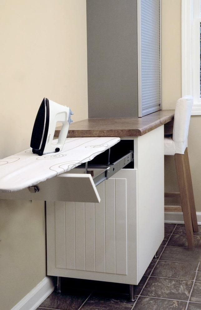 Ironing board in the cabinet