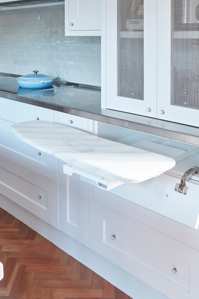 Ironing board in the kitchen