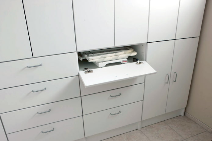 Folding board in a wardrobe drawer