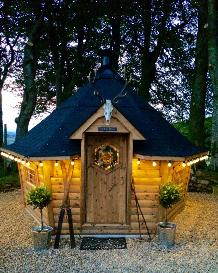 a house with a grill for a summer residence