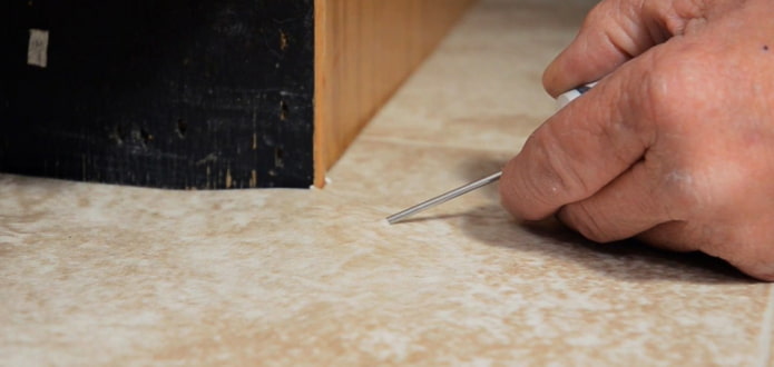 piercing with an awl piercing with an awl