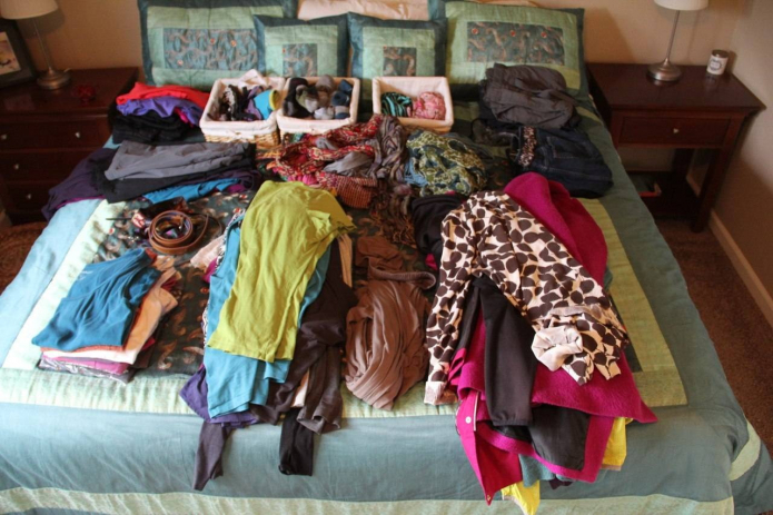 sorting things on the bed