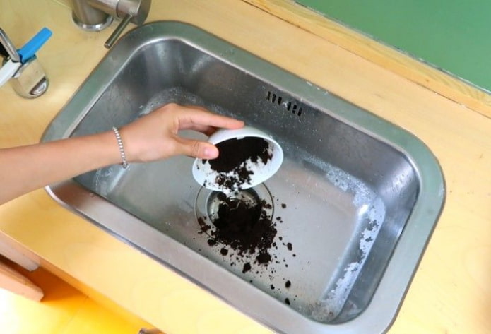 the woman throws the thick into the sink the woman throws the thick into the sink