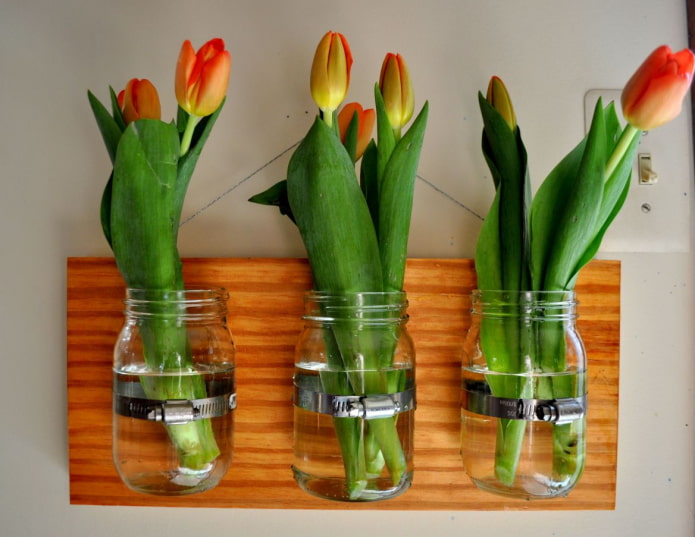 a combination of homemade flower vases from jars a combination of homemade flower vases from jars