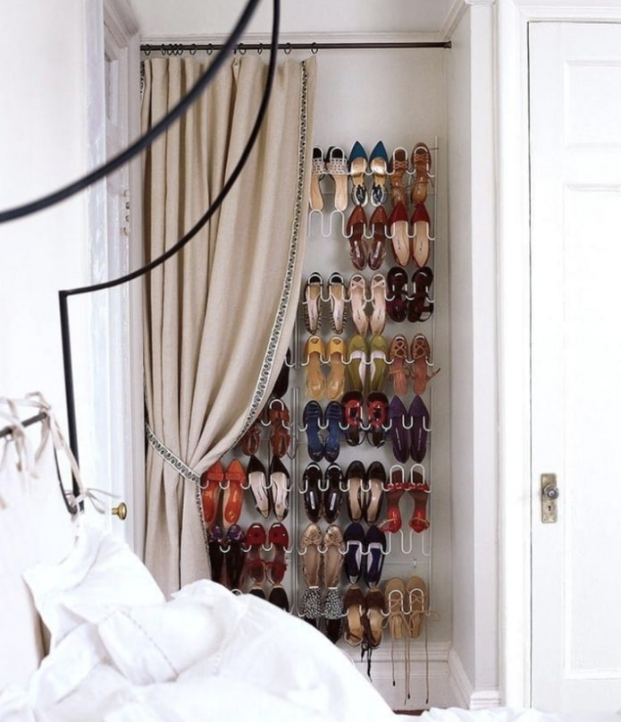 niche with clothes behind the curtain