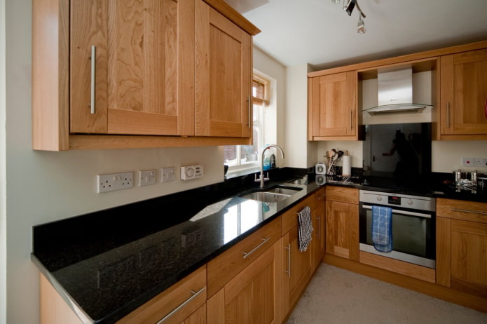 wood kitchen with black countertop