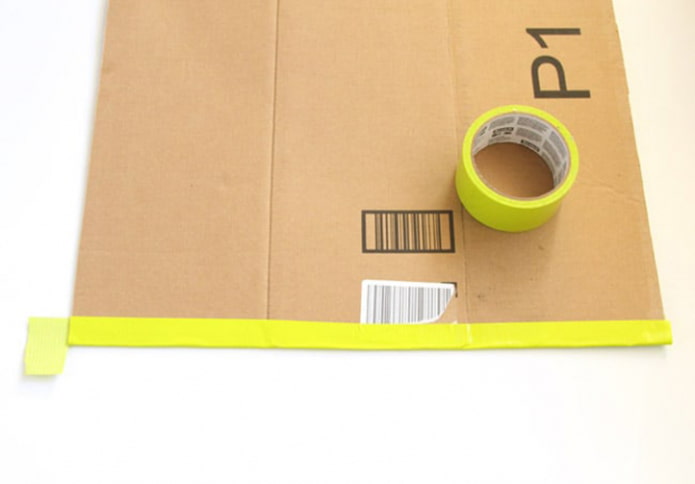 We glue the edge of the cardboard We glue the edge of the cardboard