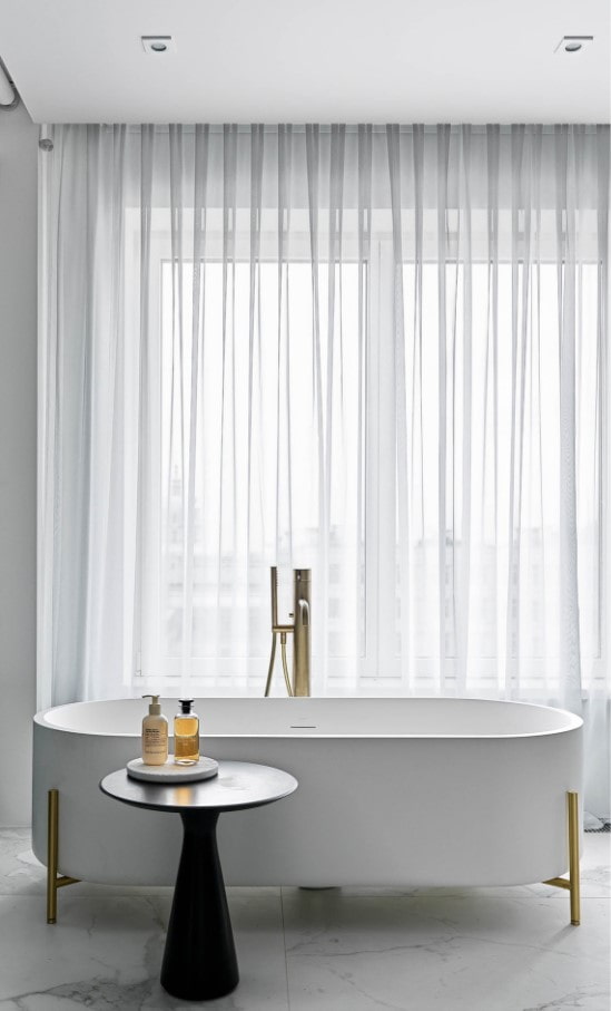 bathroom with a large window bathroom with a large window