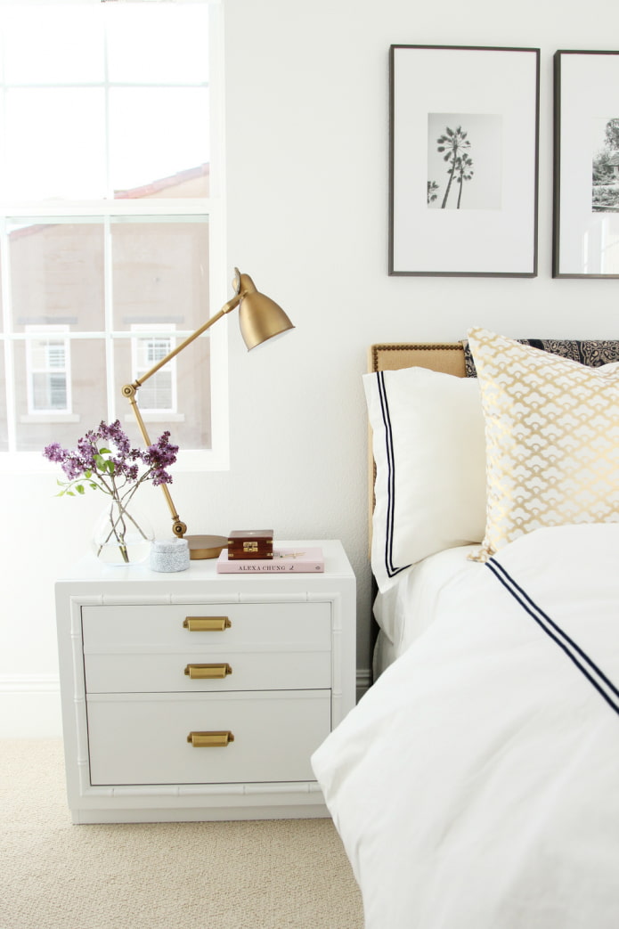 gold accents in the white bedroom
