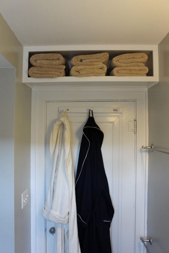 shelf with towels above the door shelf with towels above the door