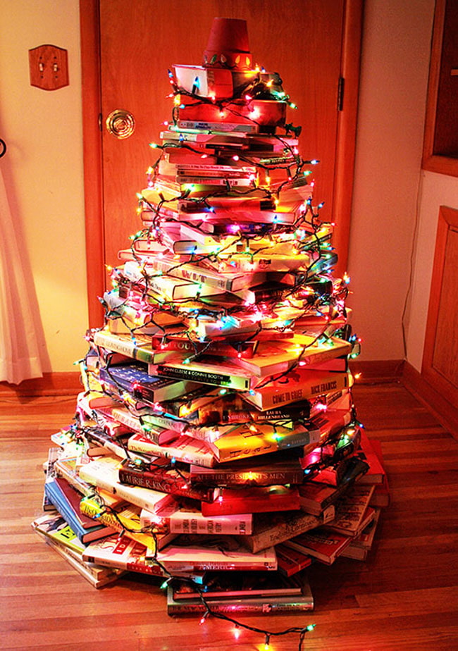Christmas tree made of books with garlands Christmas tree made of books with garlands