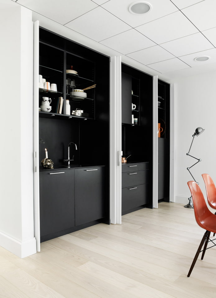 black kitchen behind sliding doors black kitchen behind sliding doors