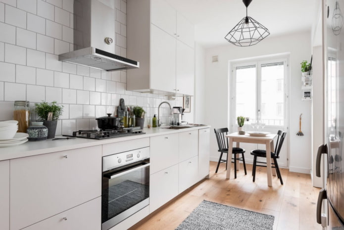 white kitchen with wood floor