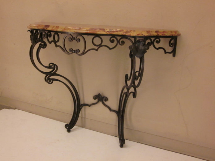 stone tabletop on a wrought-iron leg stone tabletop on a wrought-iron leg