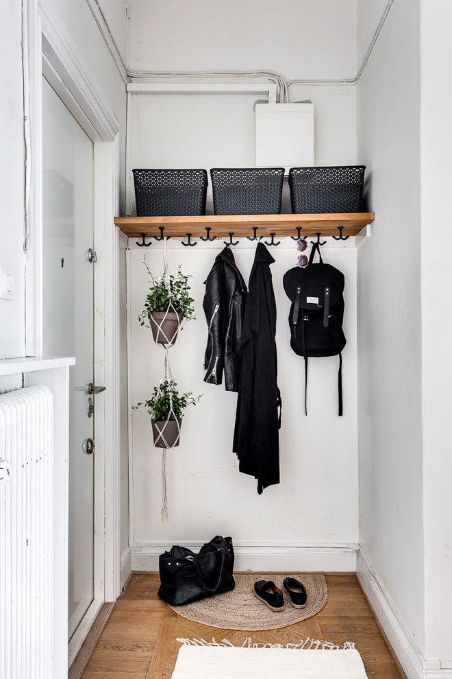 Shelf with hooks and boxes Shelf with hooks and boxes