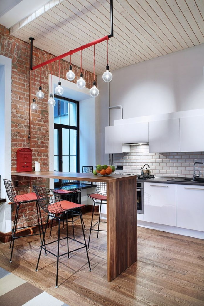 kitchen with a bar counter in a loft space