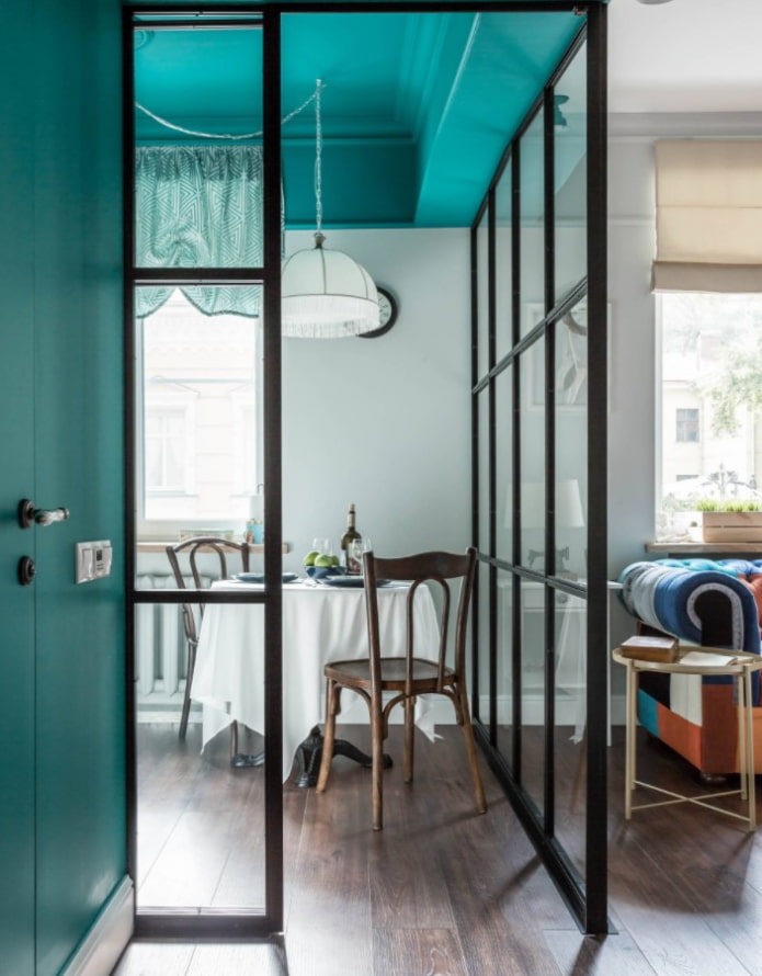 glass partition between the room and the kitchen