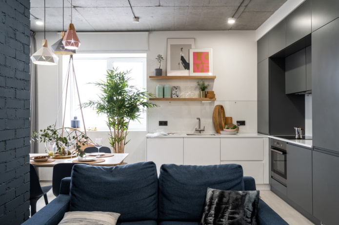 The sofa separates the kitchen