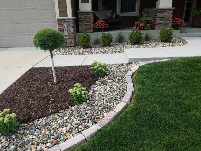 a strip of rubble along the edge of a stone border for a flower bed
