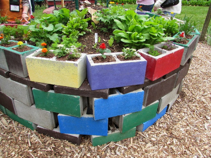 high border for a flower bed made of painted blocks