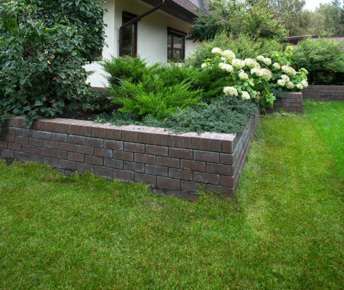 high border for a flower garden in the form of brickwork