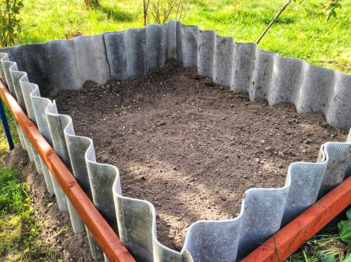 high reinforced slate fence for a rectangular flower bed