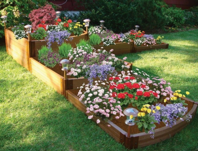 three-level flower bed with wooden sides and lighting