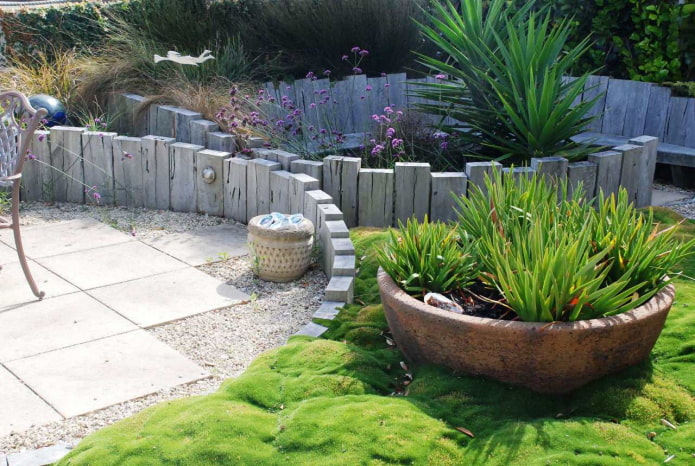 a border for a flower garden from bars dug in to different depths