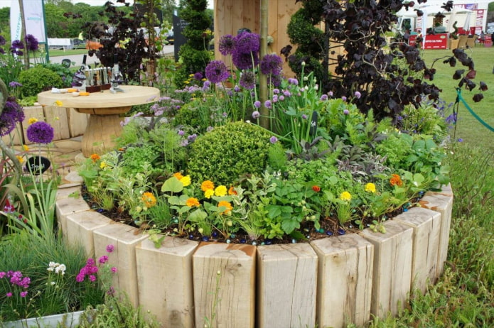 round flowerbed with a border of thick bars