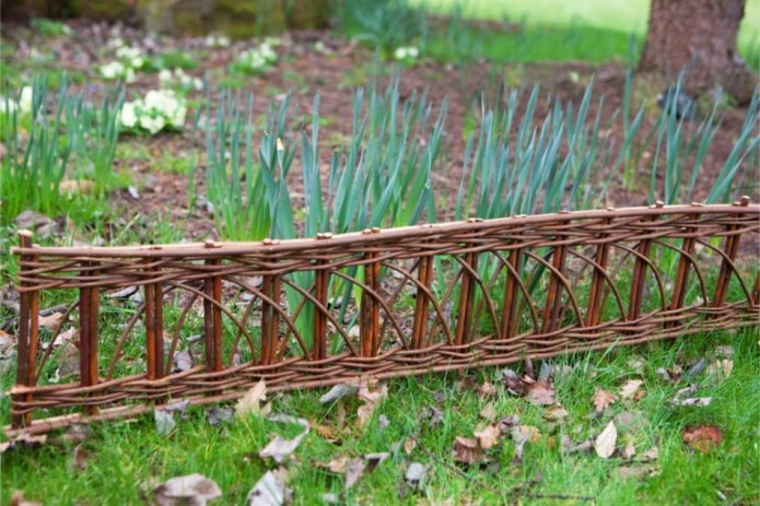 woven vine openwork fence for a flower garden