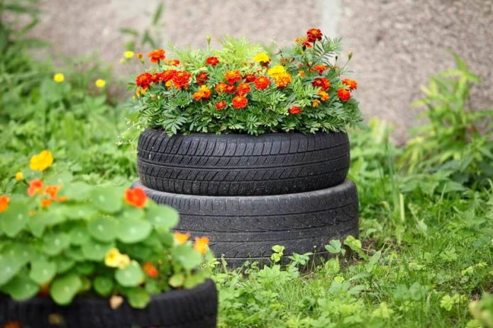 a flowerbed of two stacked tires