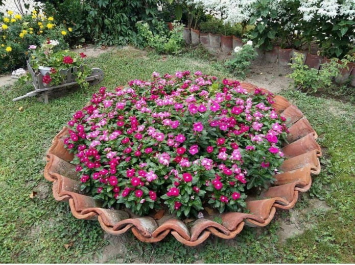 a flowerbed of vertical fragments of pots