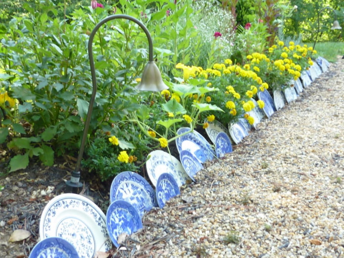 border for a flower garden from plates of different sizes