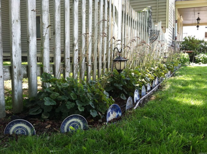beautiful plates dug in on the border of the flower garden