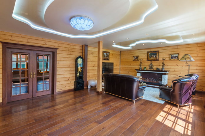 figured multi-level ceiling with lighting in a wooden living room figured multi-level ceiling with lighting in a wooden living room