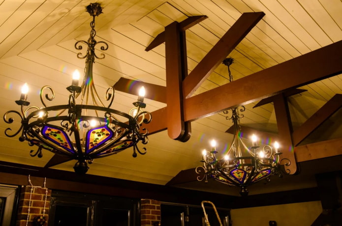 wrought iron chandeliers on the wooden ceiling wrought iron chandeliers on the wooden ceiling